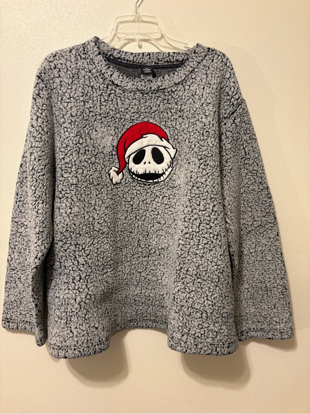 Woman’s Gray Sherpa Pullover Sweater with Festive Skull Graphic